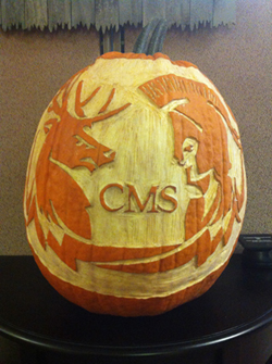 CMS Logo carved onto a pumpkin