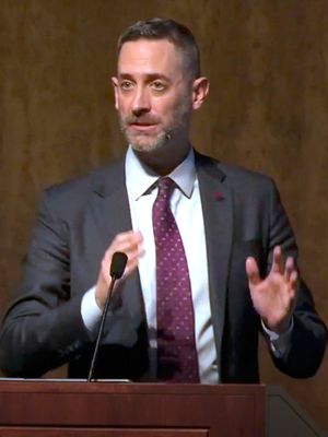 Richard Johnson ’01 at the Ath stage podium during his talk “A Nuclear Deal, if You Can Keep It – Lessons Learned from Iran and North Korea Diplomacy.