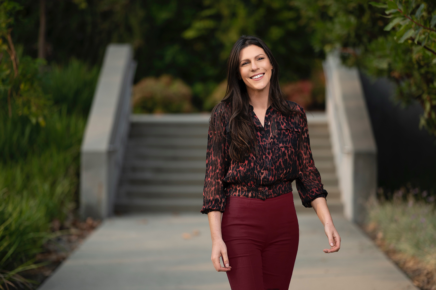 Naomi Bagdonas ’09 strolls through the CMC campus with a smile.