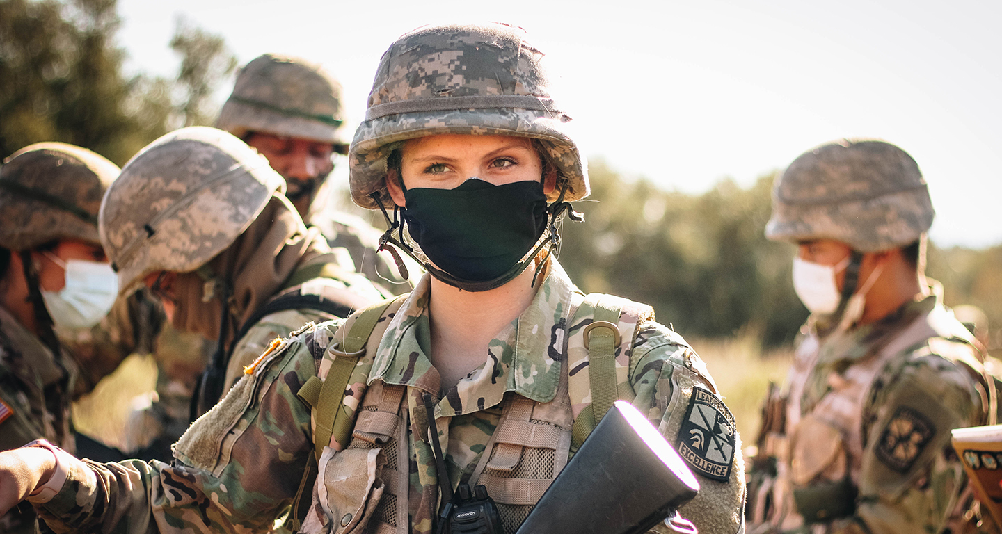 Robin Peterson '22 in camo wear at an ROTC activity.