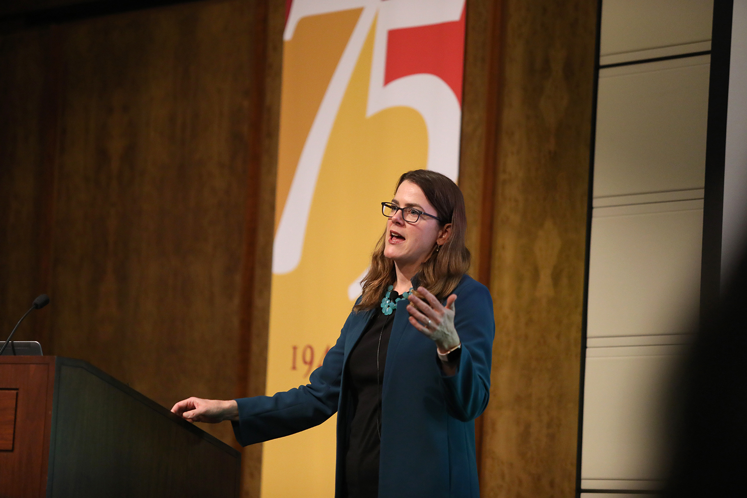 Jennifer Burns at the Ath podium during her talk.