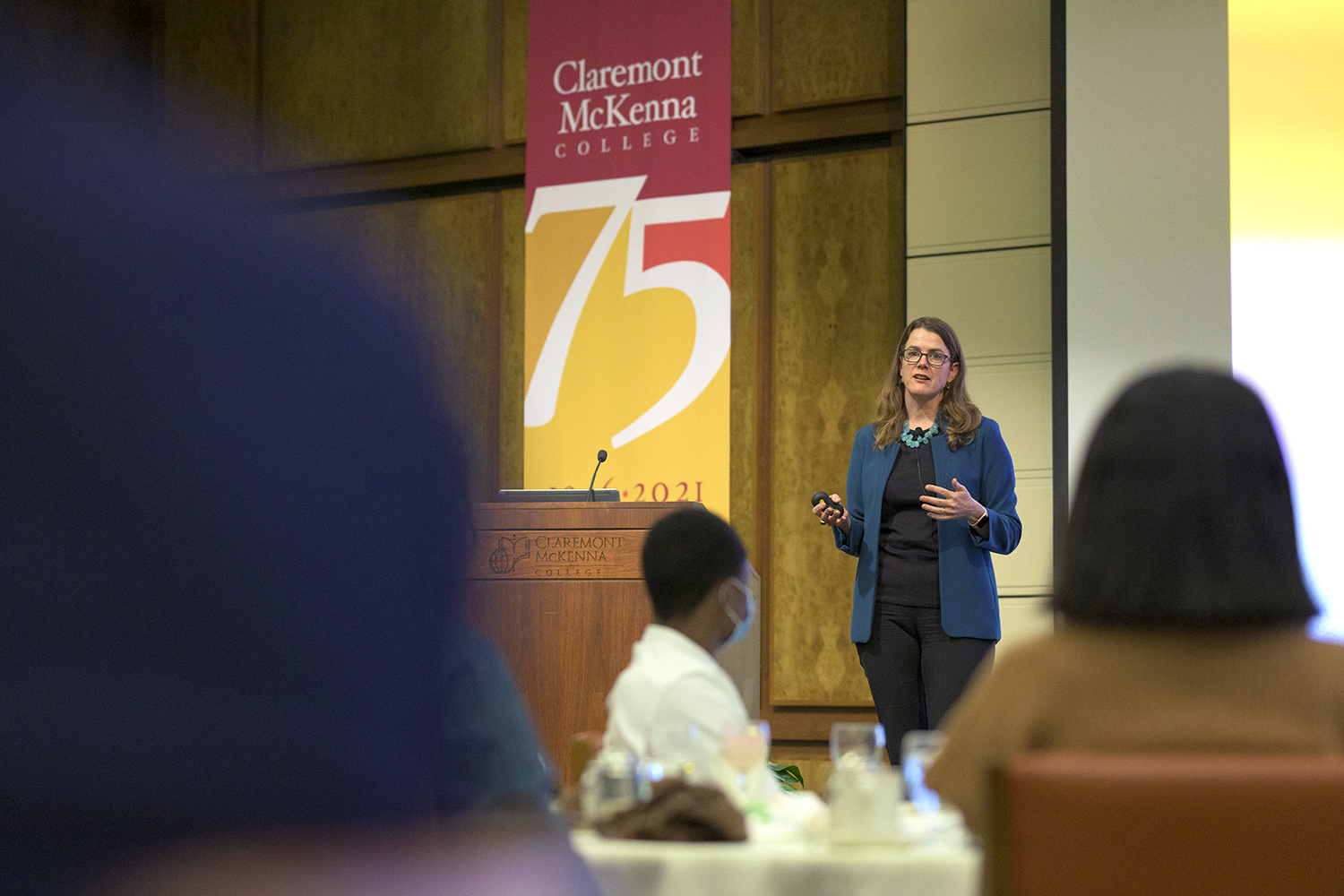 Jennifer Burns photographed during her indoor Ath talk with students seated before her.