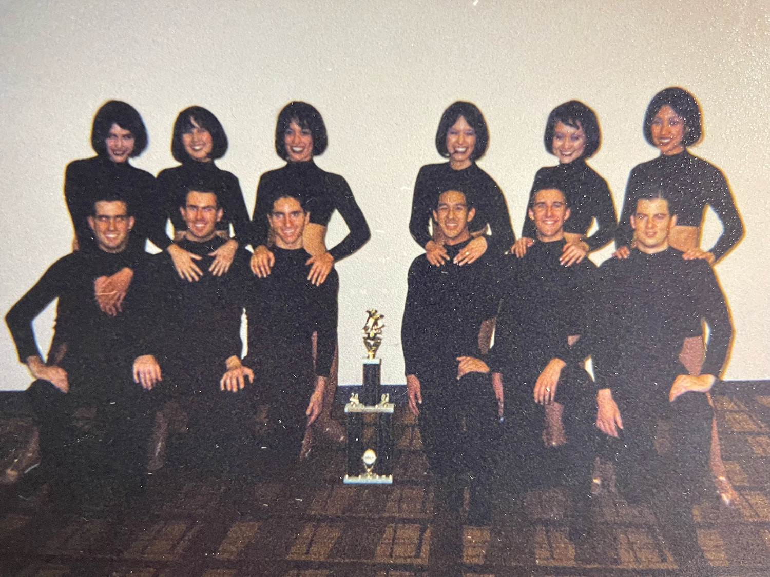 Tracy Wang '04 poses with her CCBDC dance troupe after placing in a competition.