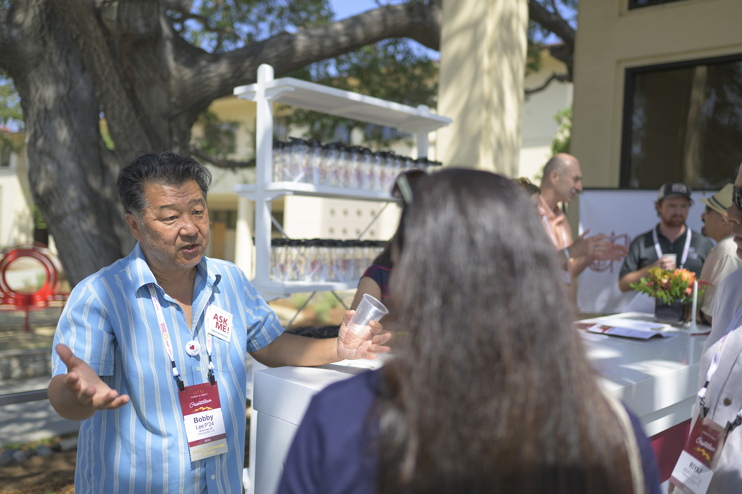 Representatives of the Parent Network Board and supporting staff answer questions outside of the resident halls.