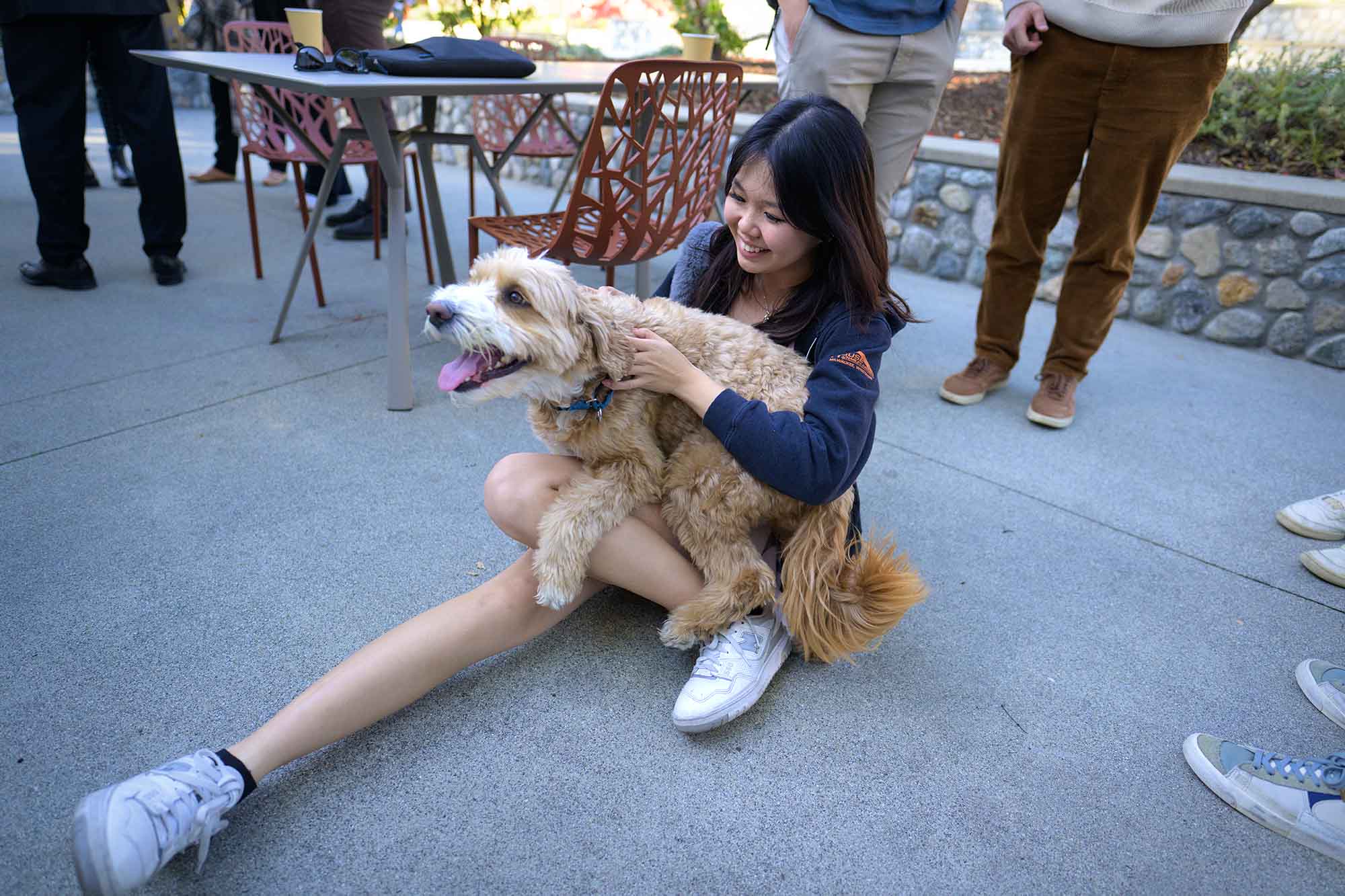 A student playing with Theo.