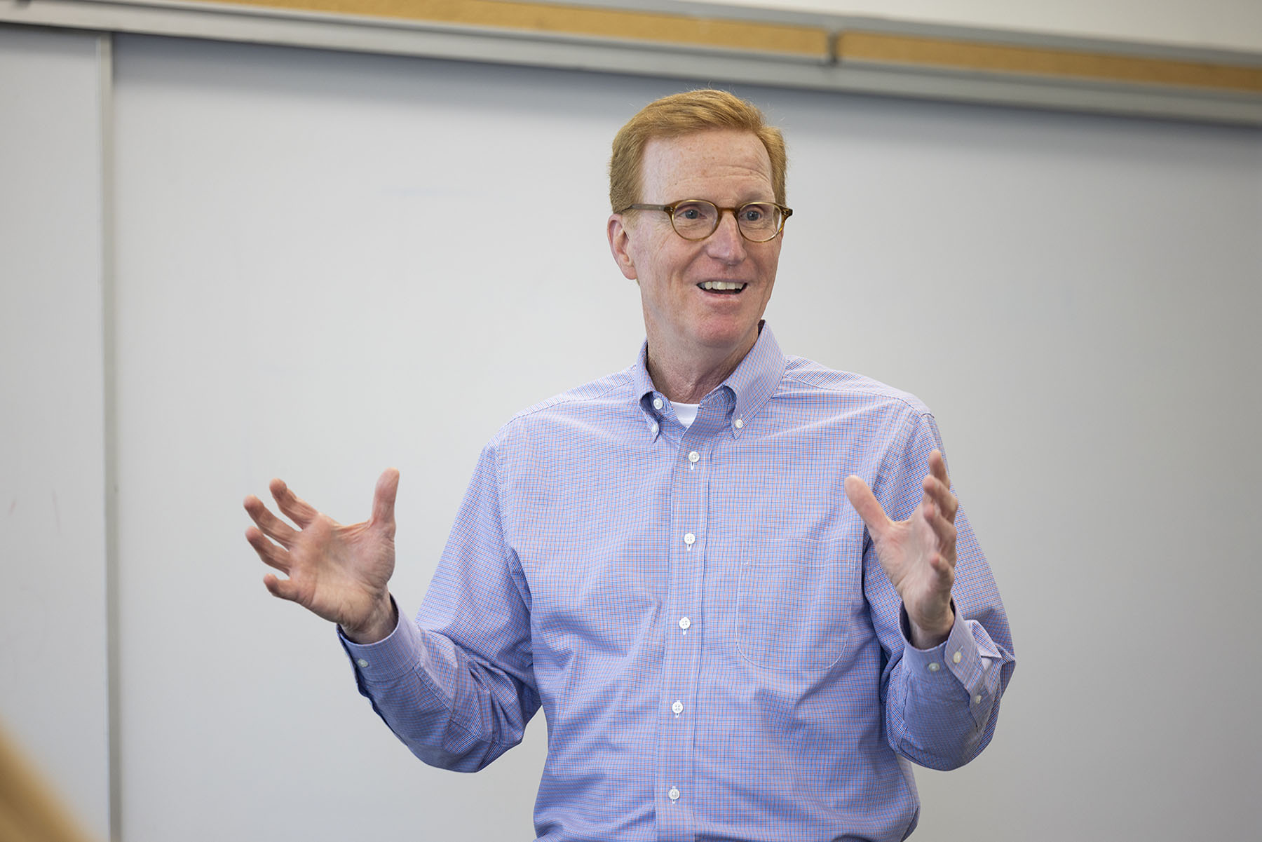 Professor Gary Birkenbeuel in  front of a class.