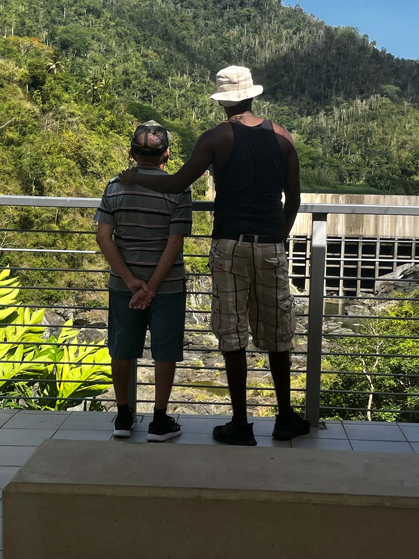 Two men looking out at the outdoors.