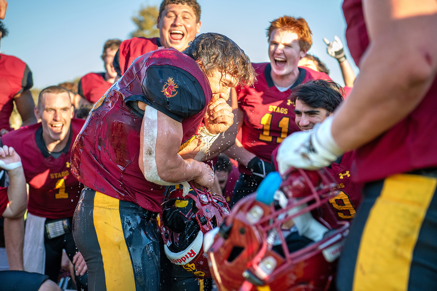 Justin Edwards, a senior, in the center of fellow football players.
