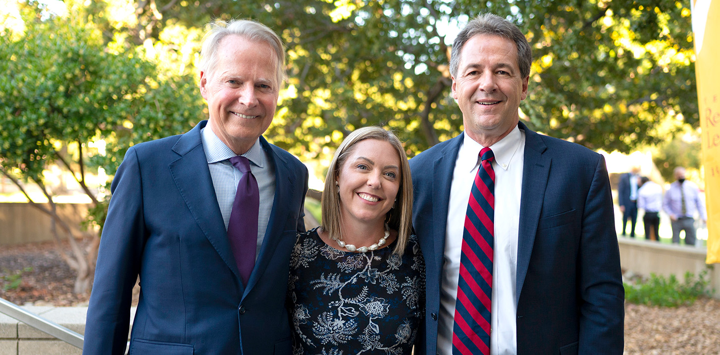 Michelle Chamberlain (center) with David Dreier ’75 (left) and another trustee.