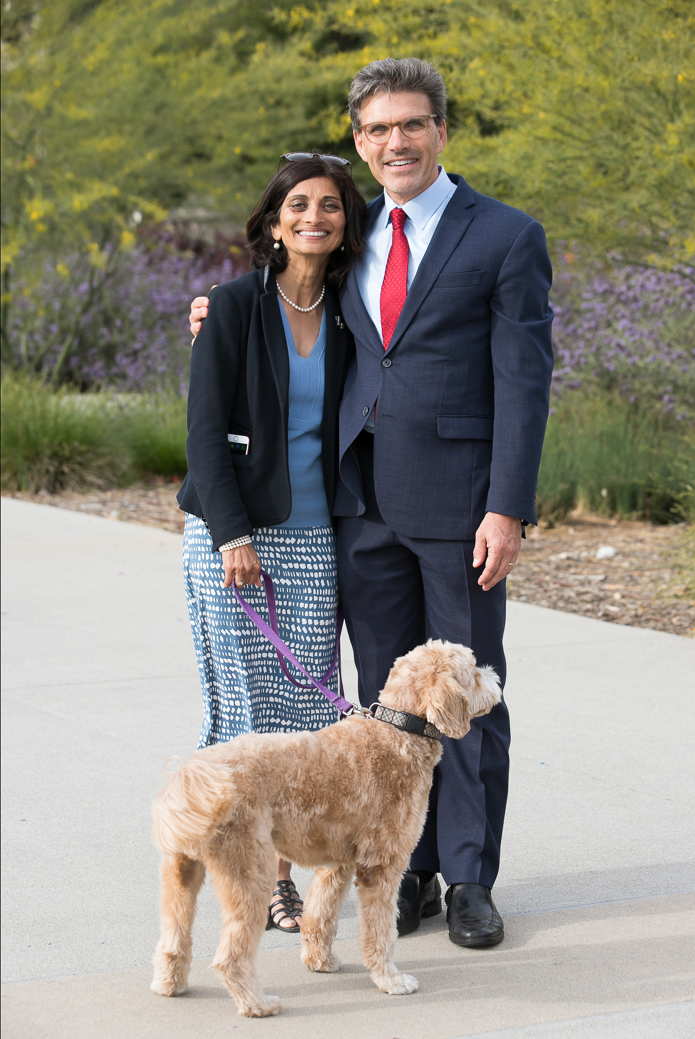 President Hiram Chodosh seen with wife Priya Junnar and dog Theo.