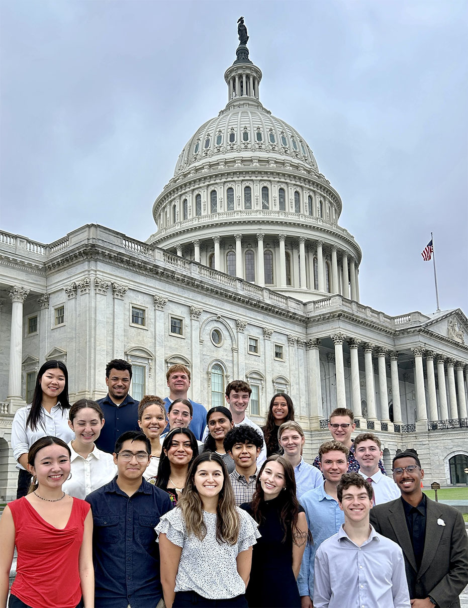 Student interns standing in front of the U.S. Captial building.