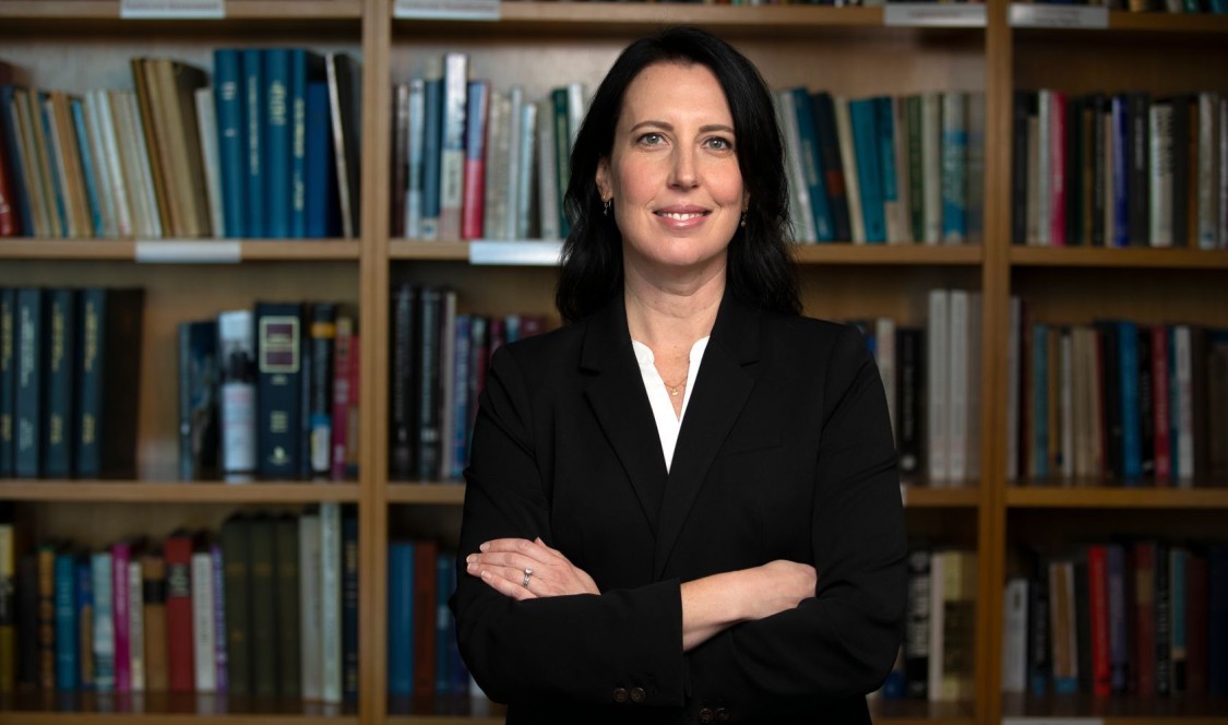 Shanna Rose wearing black suit with her arms crossed