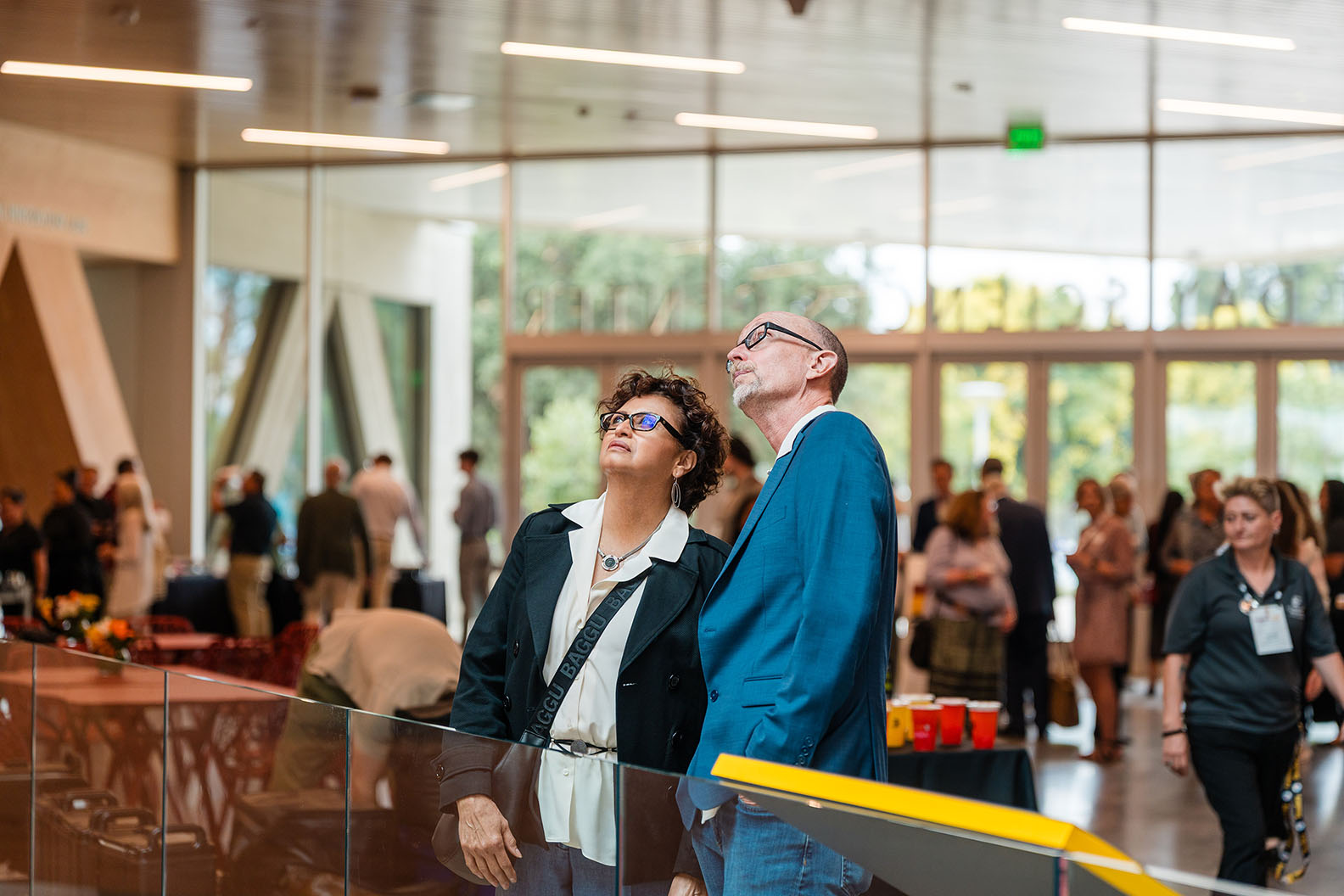 Two guests looking up at the scale of the Atrium.