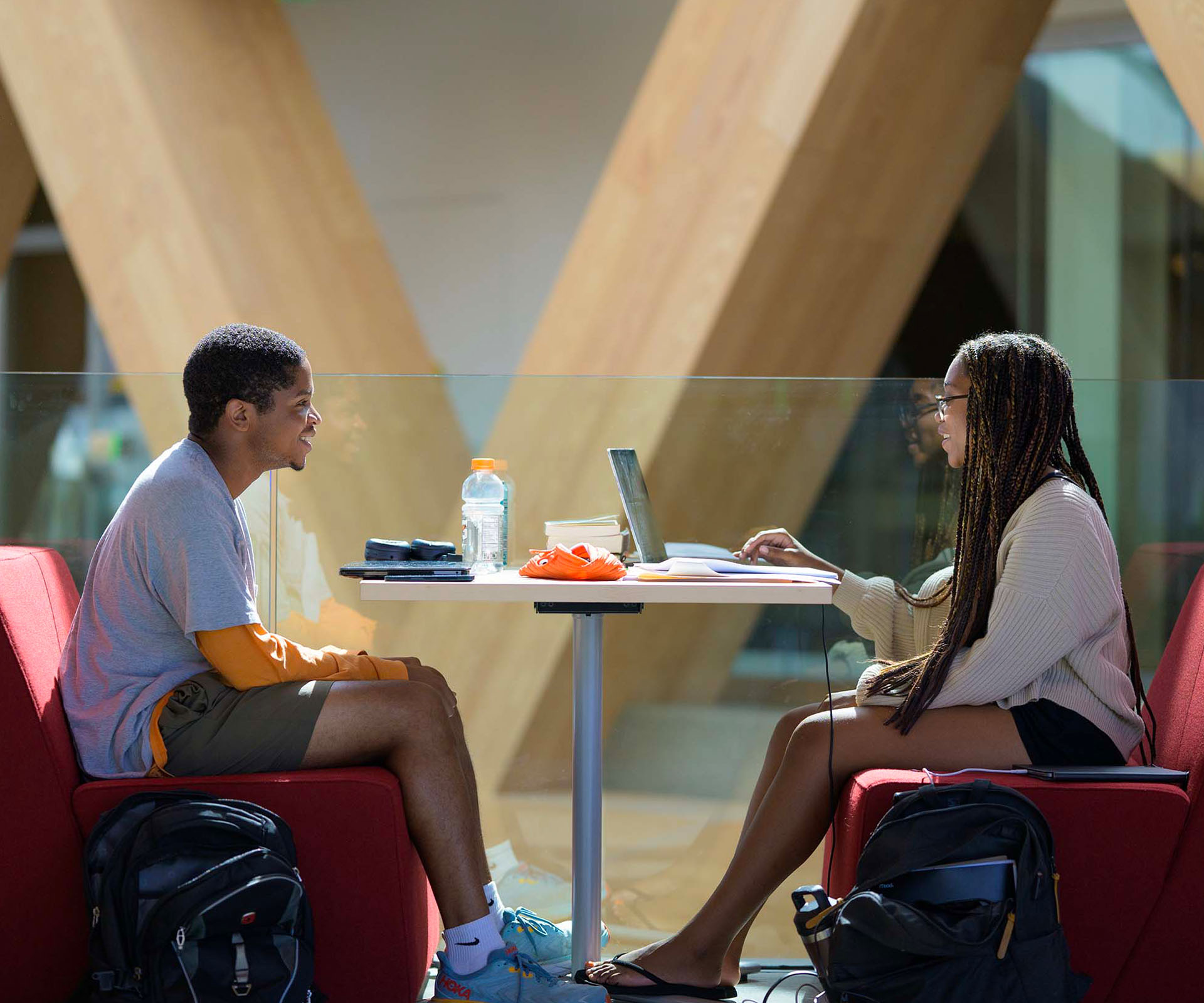 Two students share a moment in one of the booths at the RDSC.