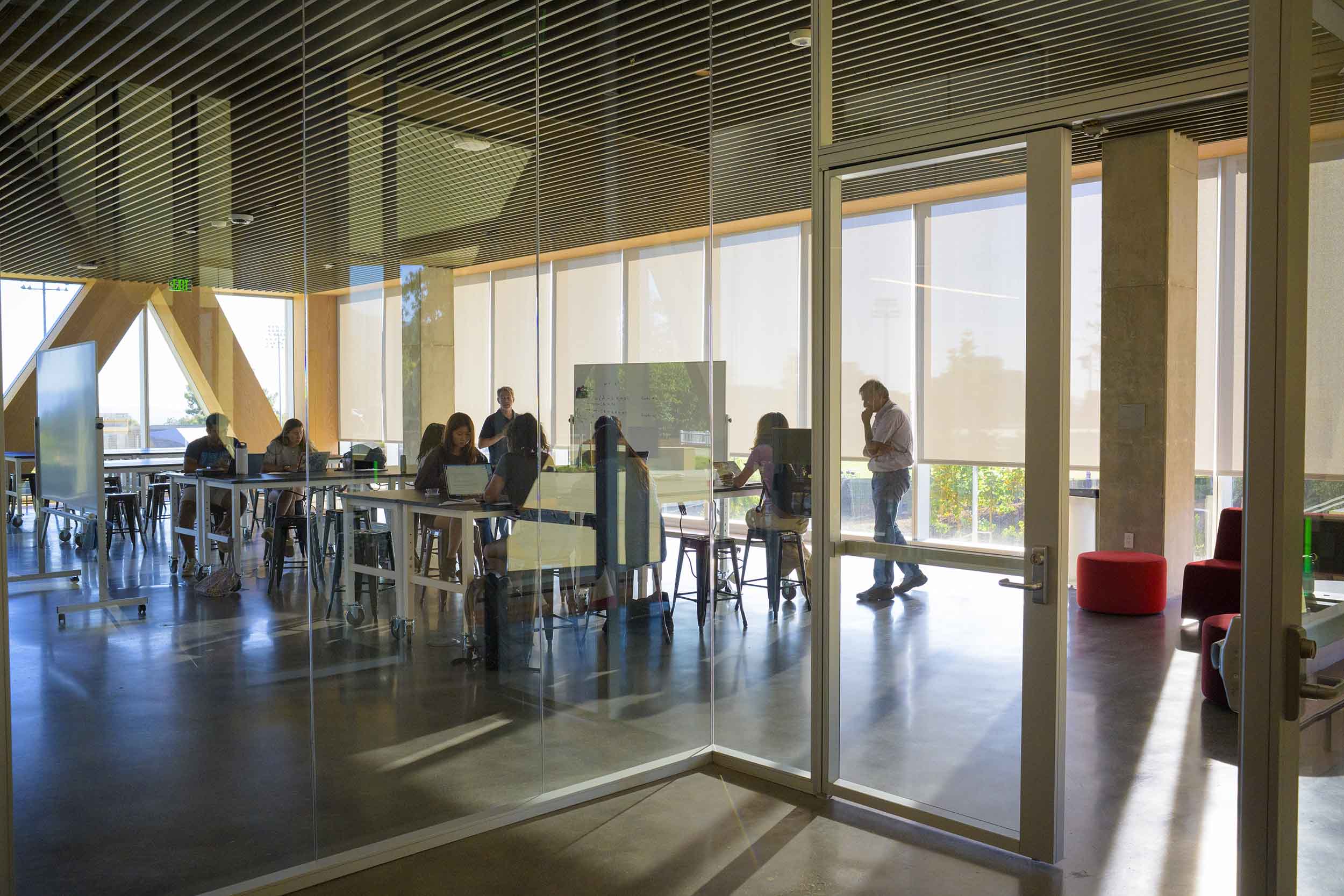 Students working on laptops in an RDSC classroom.