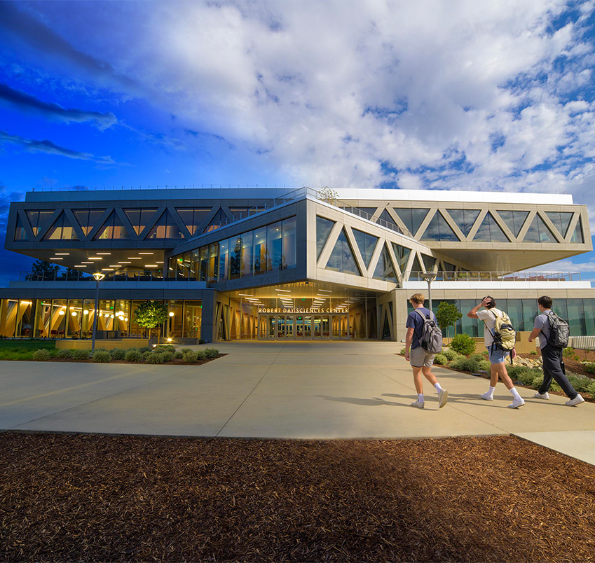 Composite of the Robert Day Sciences Center at night and day.