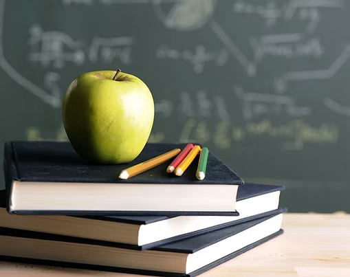 Image of an apple on books