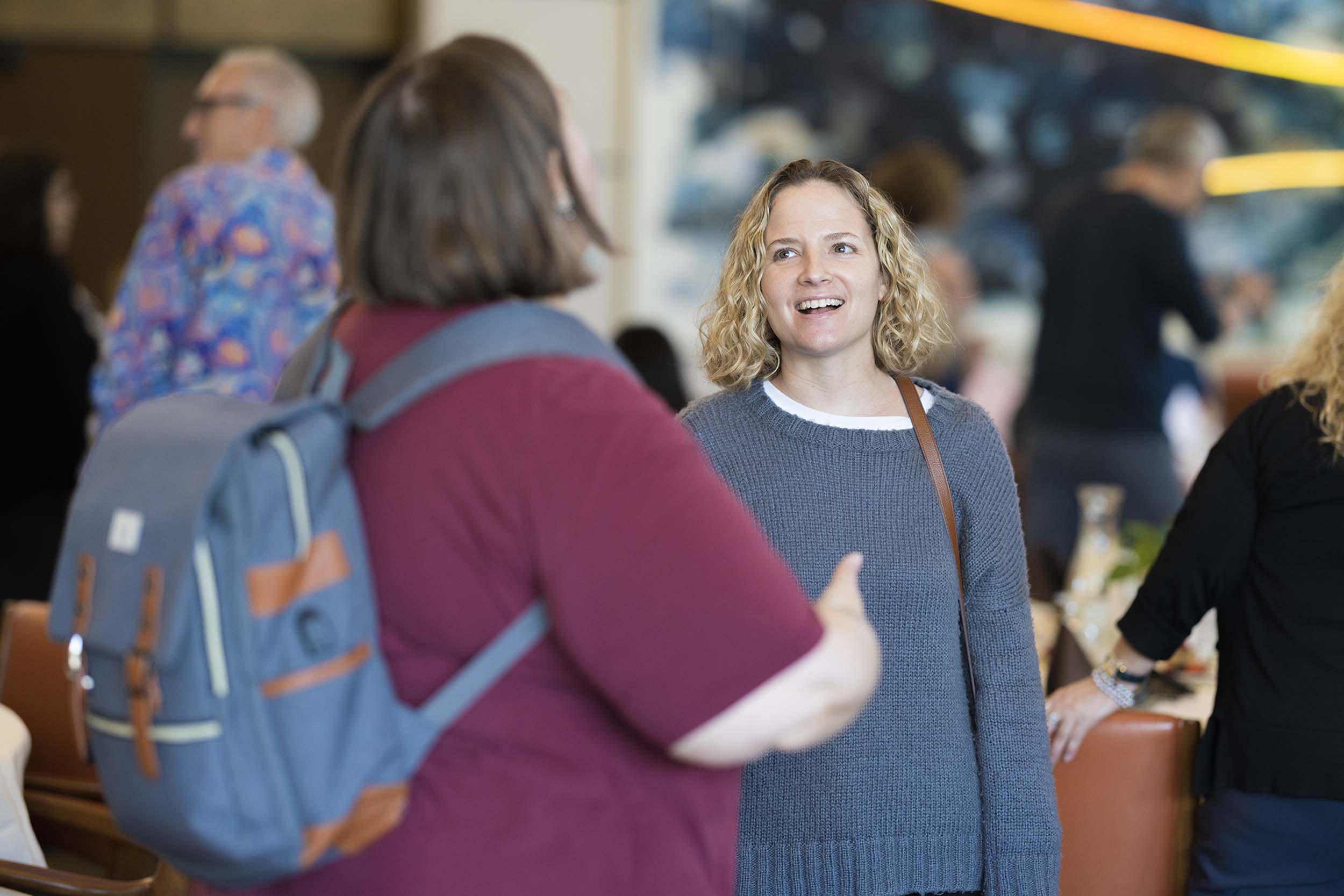 Two faculty members having a conversation.