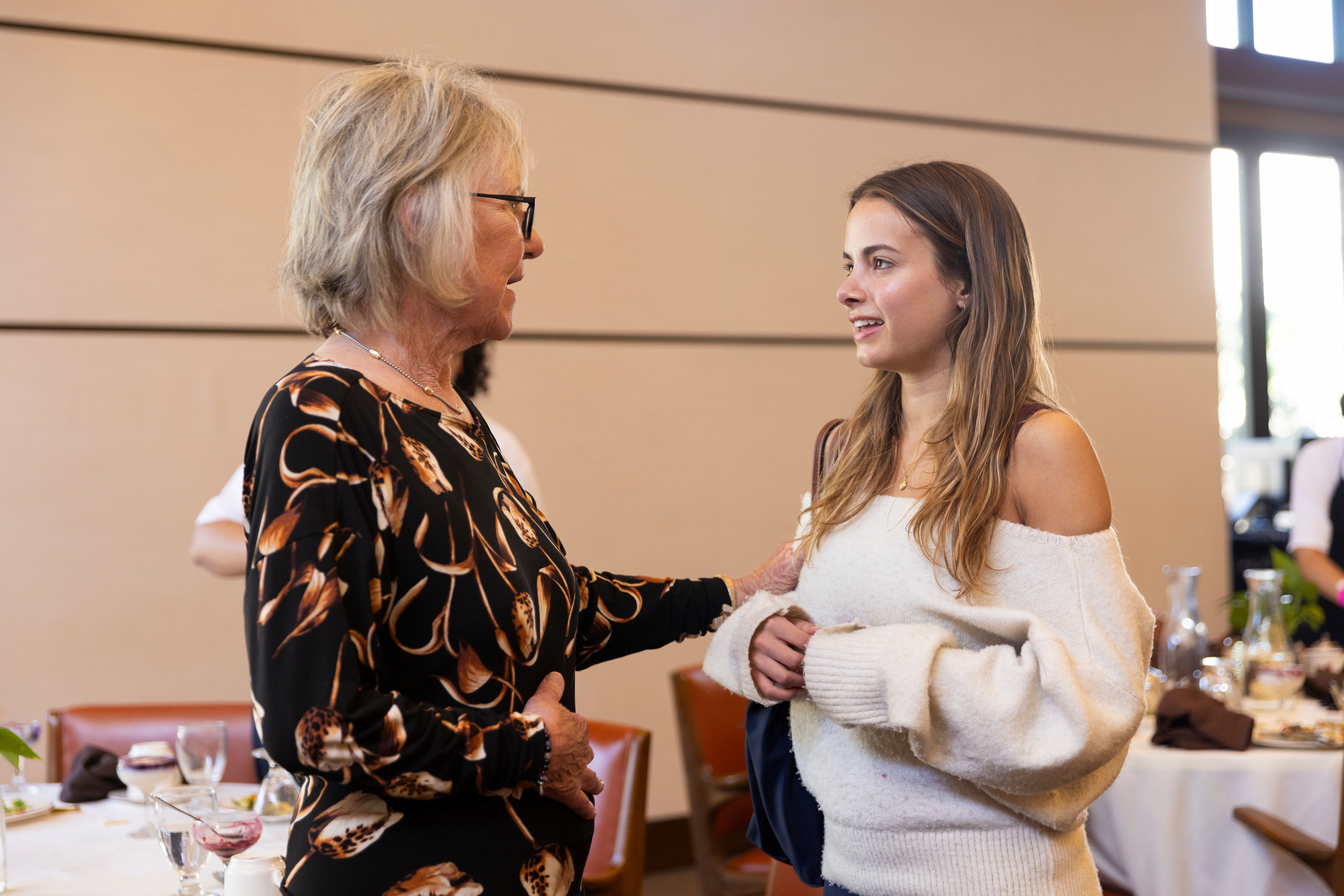 2026 WLA Conference keynote speaker engages with student in the audience.