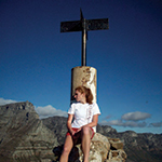 Student standing in front of landmark