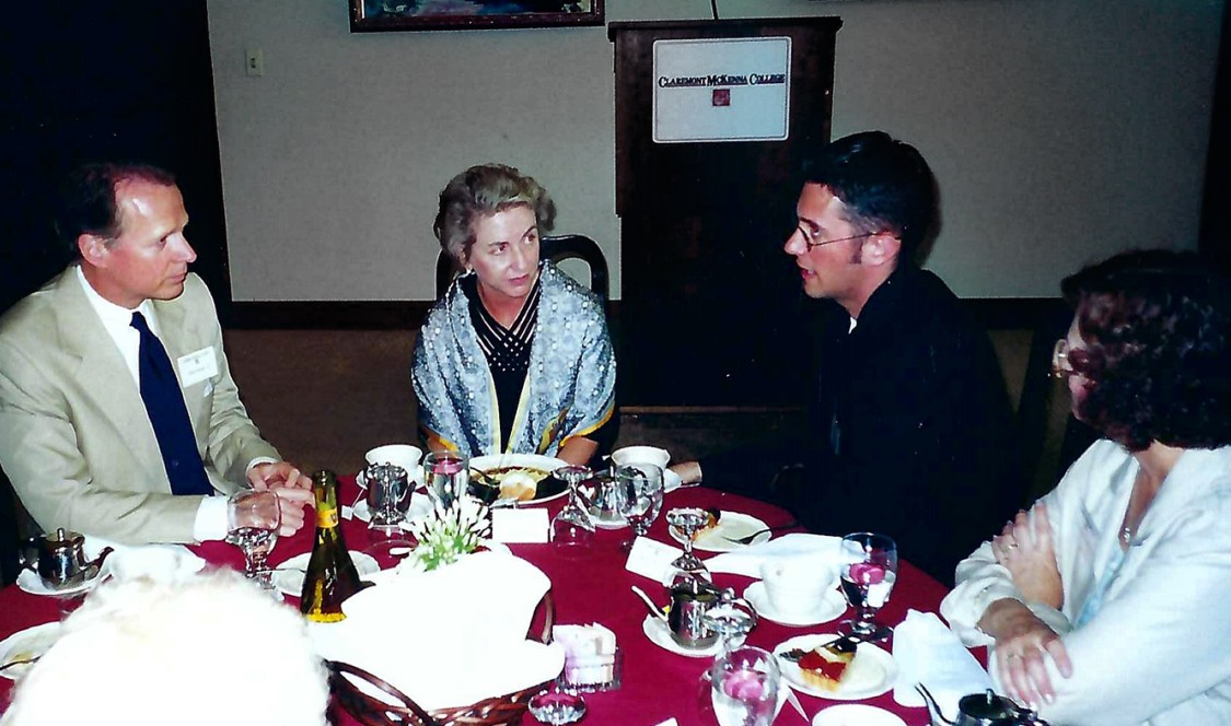Richard Johnson ’01 sitting with President Pamela Gann and David Dreier '75