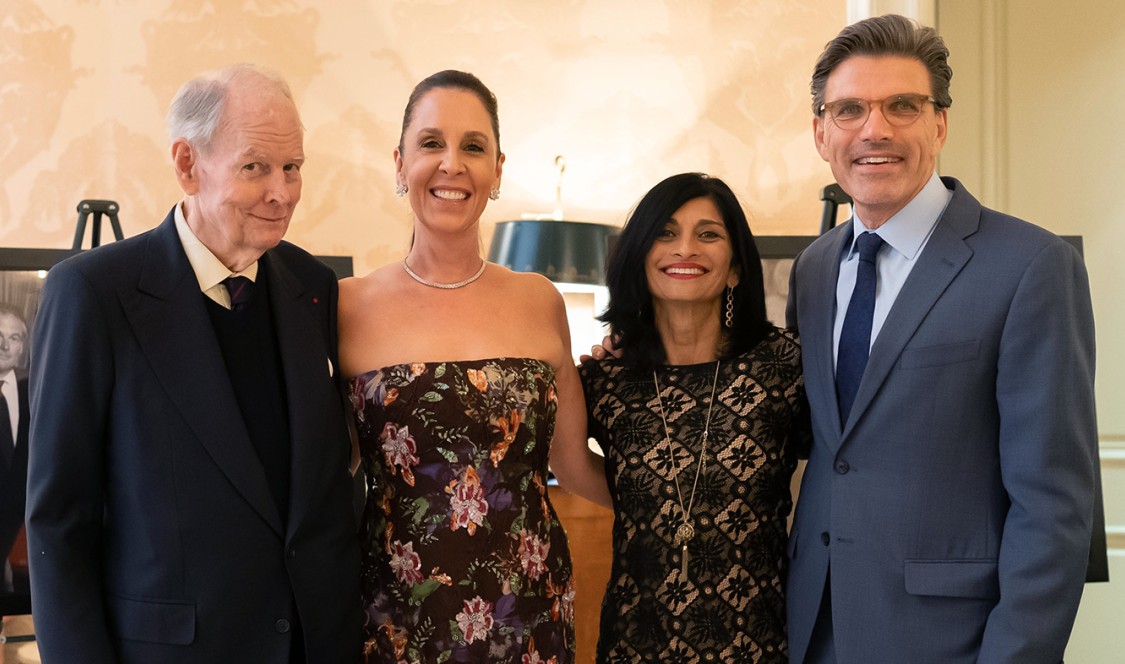 Robert Day (left) in a group photo with CMC's current President's wife, Priya Junnar, and President Hiram Chodosh, at an event.
