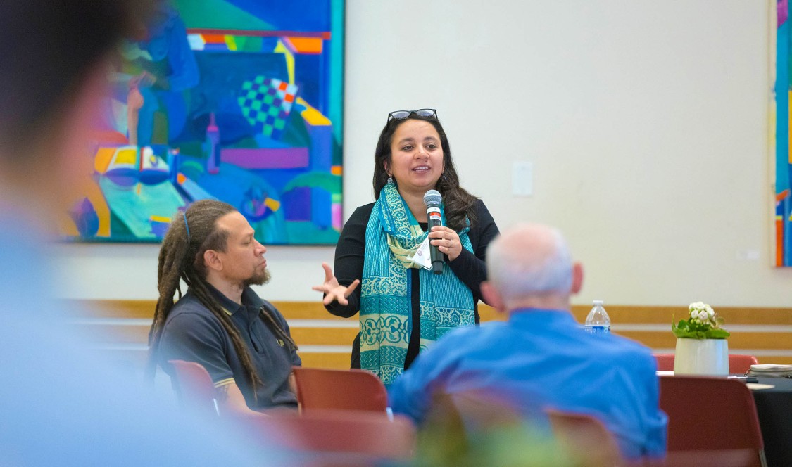 Prof. Radhika Koul speaking in front of class