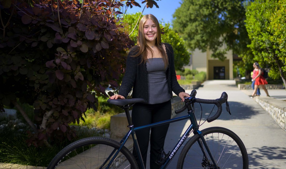 Josephine Aspromonte standing with bike