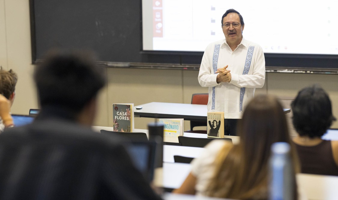 Prof. Salvador Velazco speaking in front of class
