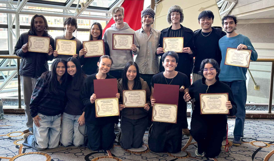 MUN students posing with their awards