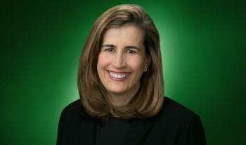 Studio portrait of Tina Daniels on green radial background