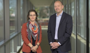 CMC Professors Heather Ferguson and Jon Shields in the hallway of Kravis Center.