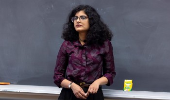 Prof. Panda standing in classroom