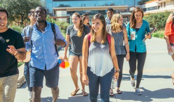 A group of CMC students walk from the Kravis Center.