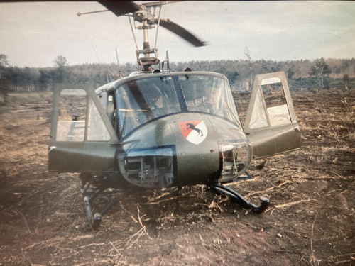 Gilbert Ferrey '64 in his military helicopter.