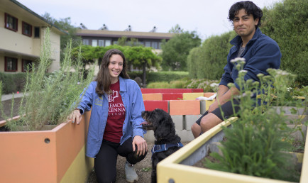 Elmir Kouliev ’24 and Zoe Carlson ’22 in the garden near Beckett Hall