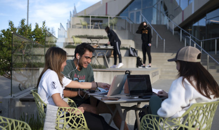 Students work together on the Colorado Terrace by Roberts Pavilion.
