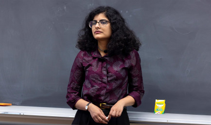 Prof. Panda standing in classroom
