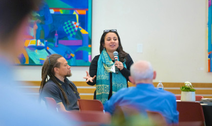 Prof. Radhika Koul speaking in front of class