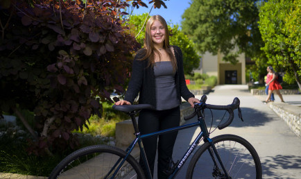 Josephine Aspromonte standing with bike