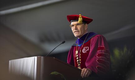 President Chodosh addressing the 2026 graduates at Commencement.