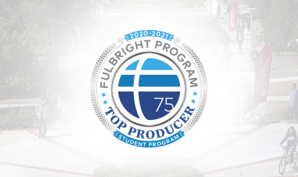 Fulbright logo with white halo on background image of CMC campus