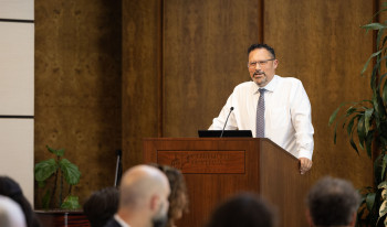 Prof. Nick Buccola at podium