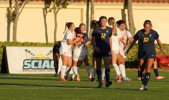 CMS Women's soccer celebrating on the field