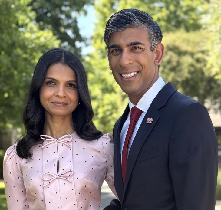 Rishi Sunak and Akshata Murty standing in garden