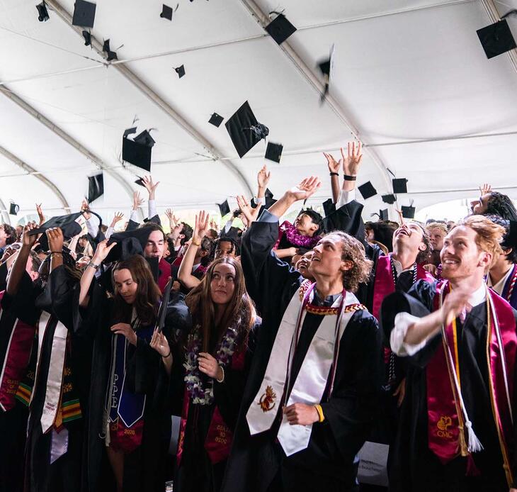 The Class of 2026 tossing their caps after the ceremony.