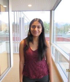 headshot of Ishita Gupta wearing a red top