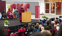President Dudley at the podium in Roberts Pavilion during Convocation