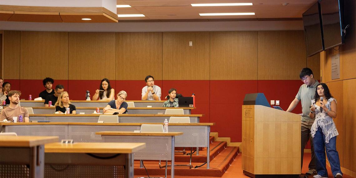 Student at podium presenting work from Summer Research Program 