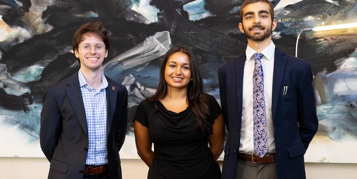 2026-27 Ath Fellows: Jasper Langley-Hawthorne ’27, Ambika (Bika) Gupta ’27, and Shivom Parihar ’28 standing in the Ath
